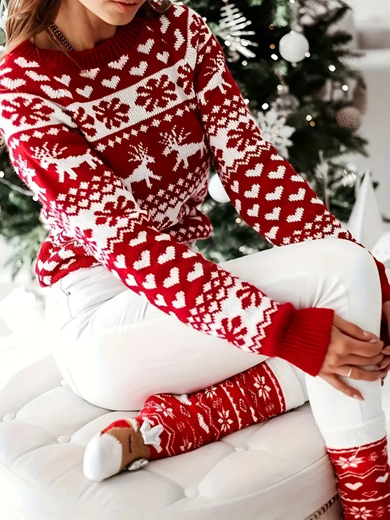 Yara | Festive sweater with a reindeer and snowflake design.