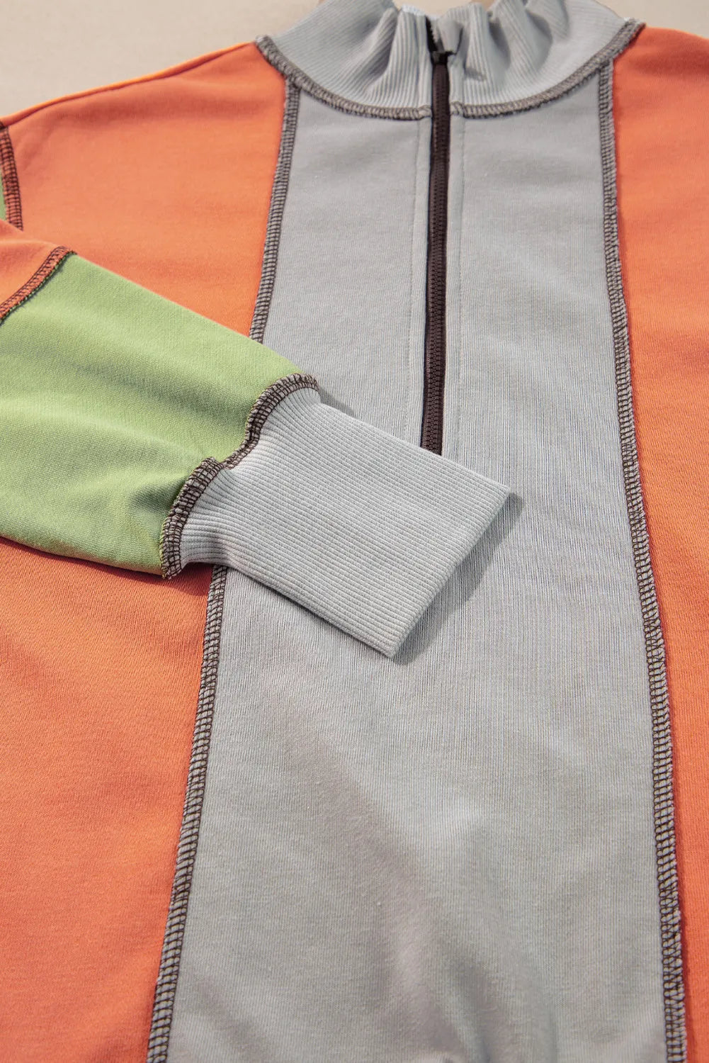 Andrea | Full size long sleeve sweatshirt with exposed seams and color block pattern