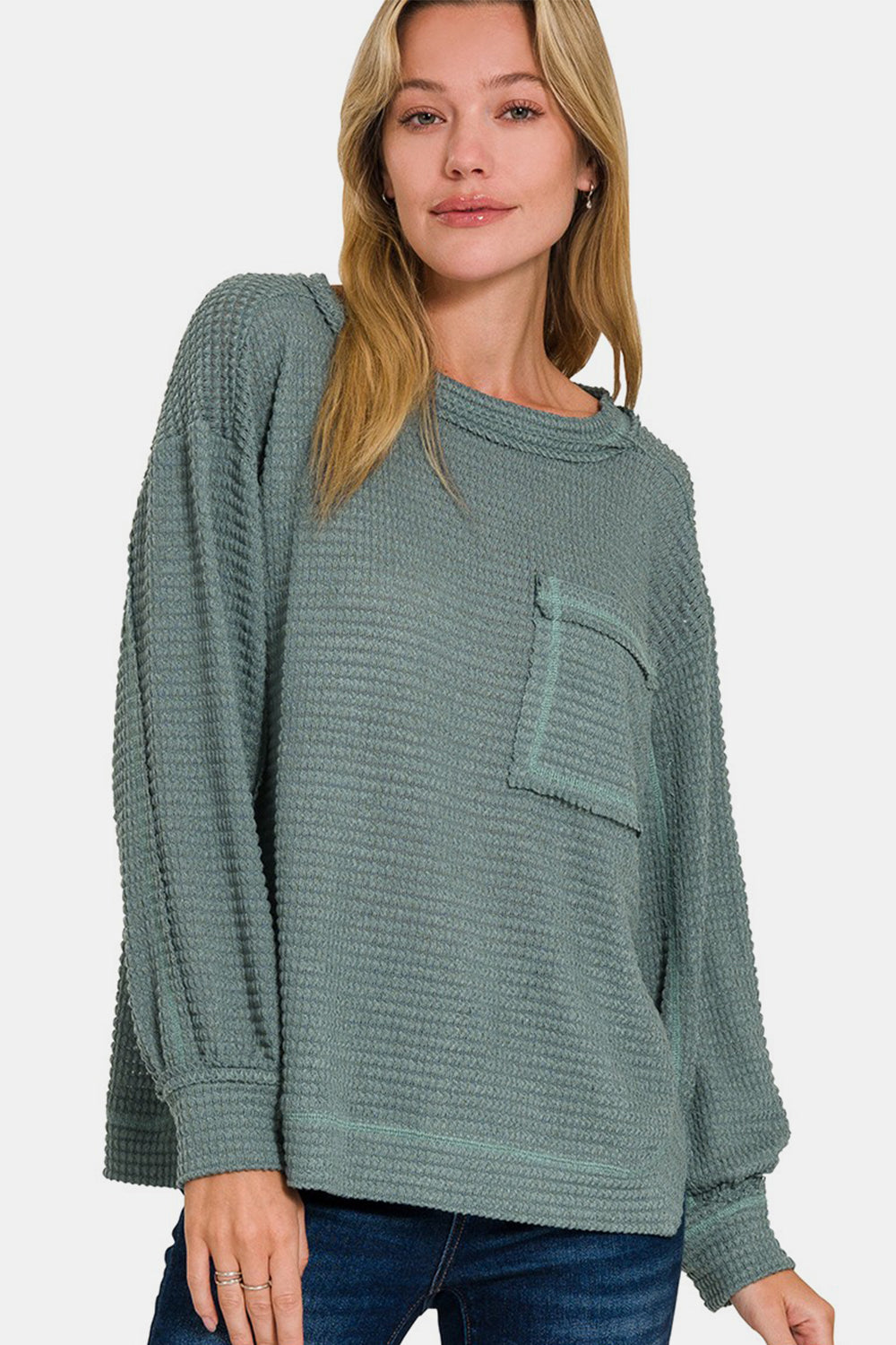 Daria | Long sleeve top with exposed seam and side slit