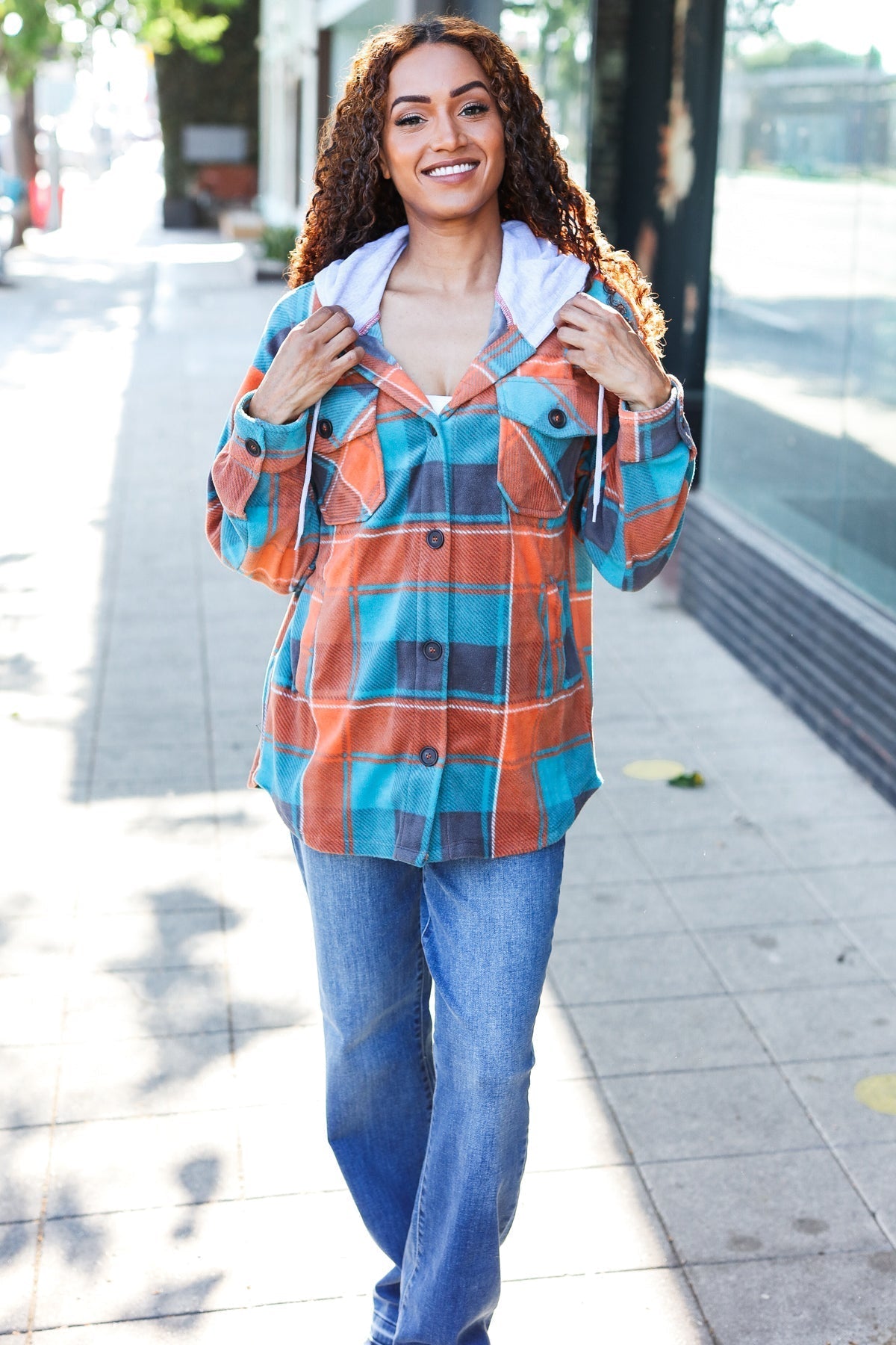 Karin | Standout fleece hoodie jacket with a check pattern in teal and orange