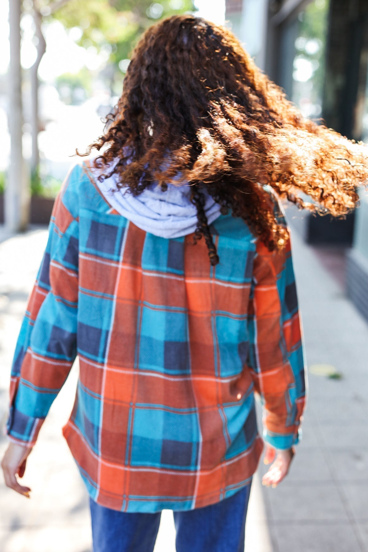 Karin | Standout fleece hoodie jacket with a check pattern in teal and orange