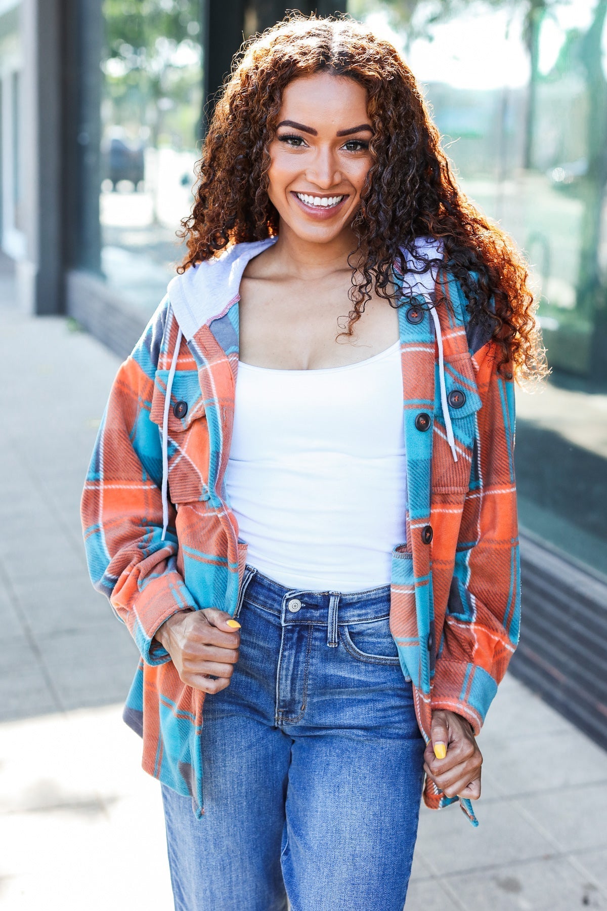 Karin | Standout fleece hoodie jacket with a check pattern in teal and orange