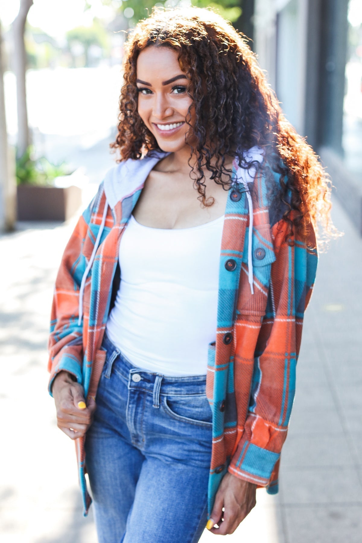 Karin | Standout fleece hoodie jacket with a check pattern in teal and orange