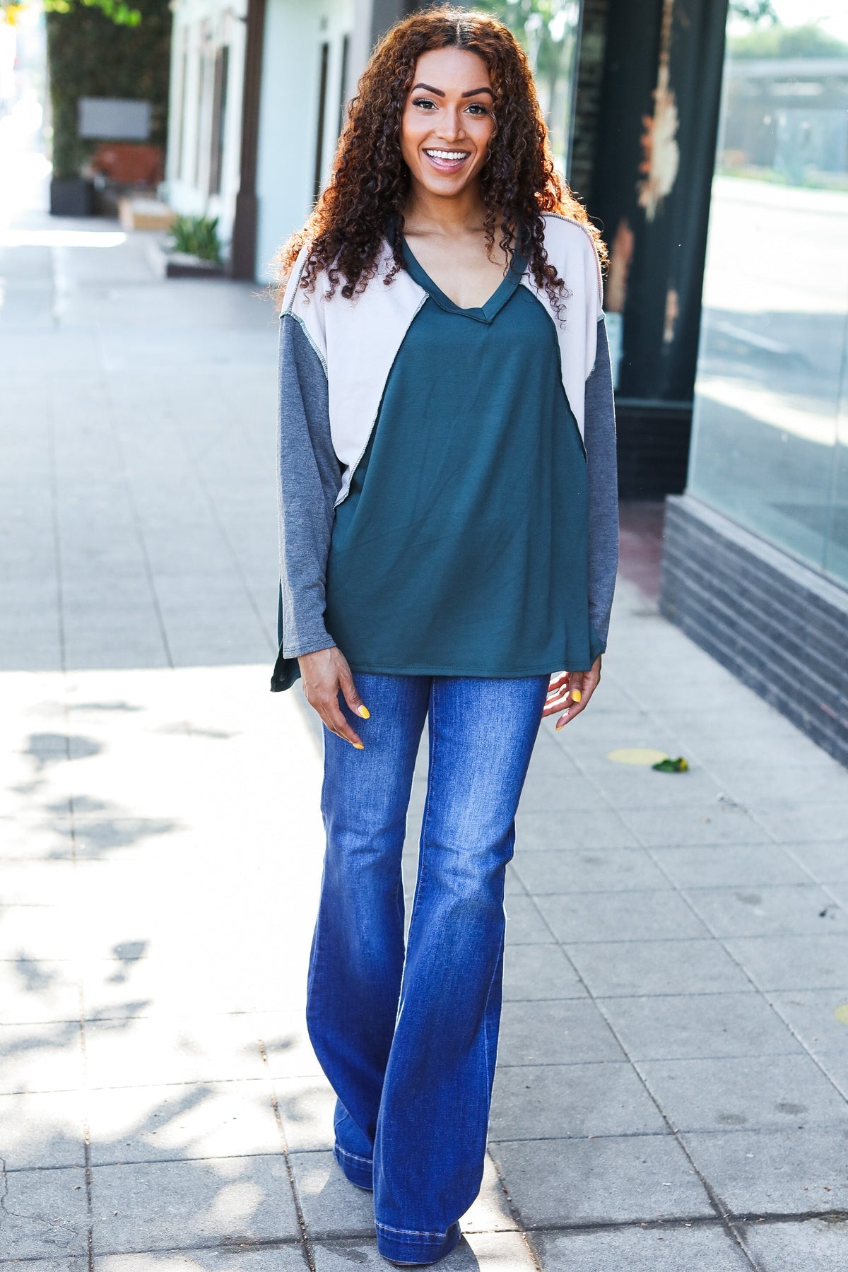 Beate | Standout hunter green raglan top with color block outseam and V-neckline