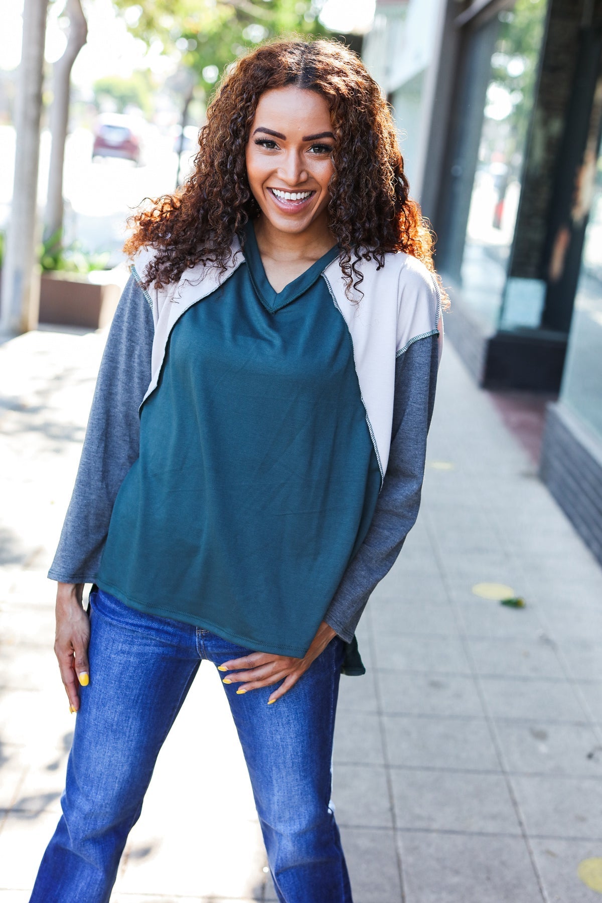 Beate | Standout hunter green raglan top with color block outseam and V-neckline