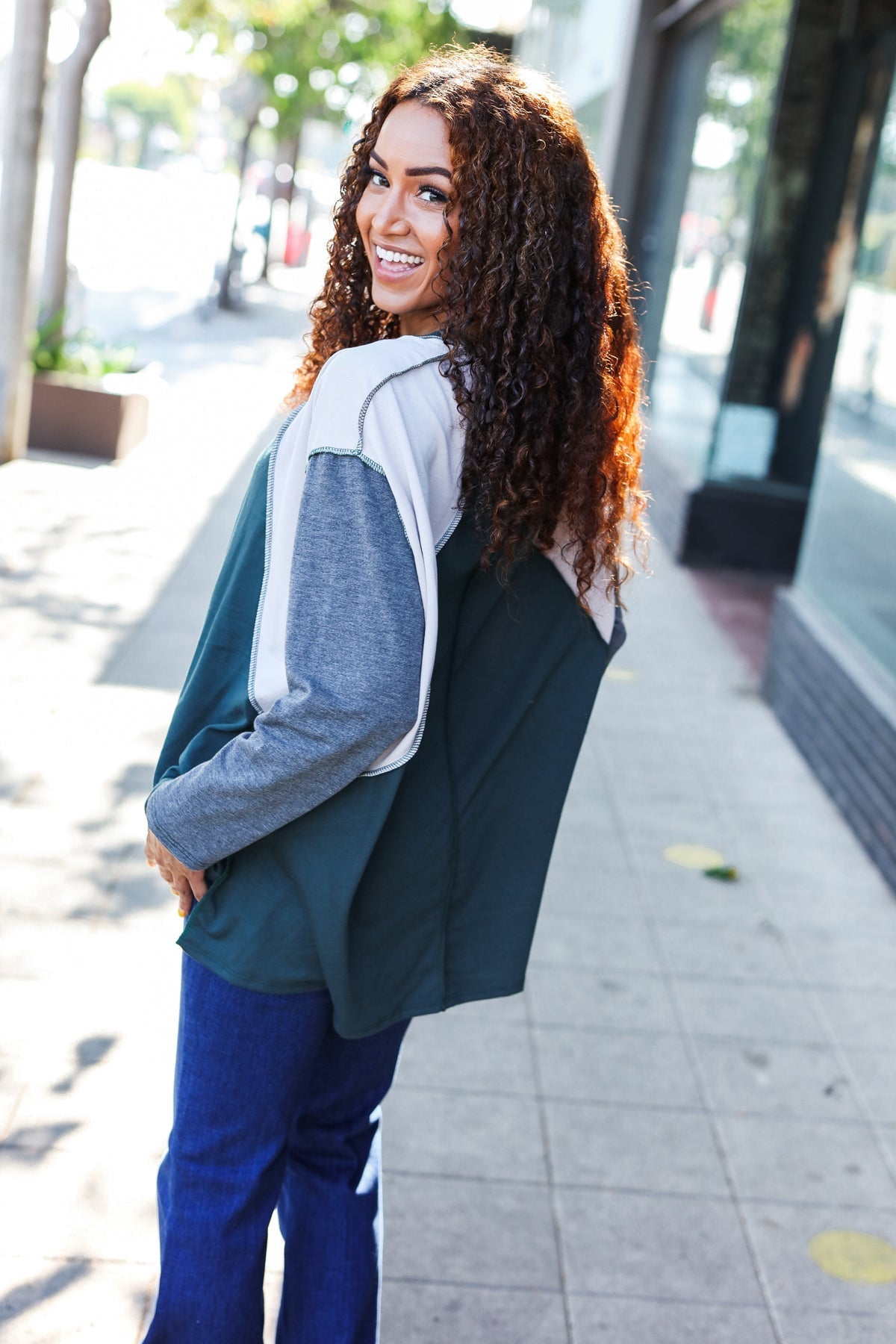 Beate | Standout hunter green raglan top with color block outseam and V-neckline