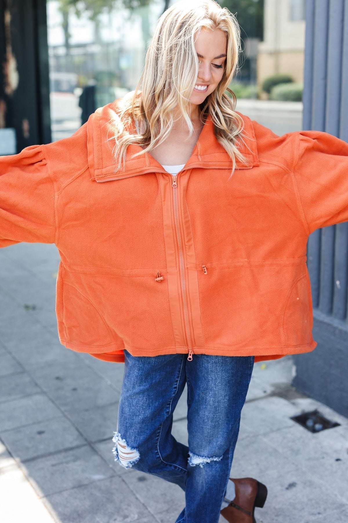 Xaviera | Beautiful You Rust fleece jacket with a fitted waist and zip fastening