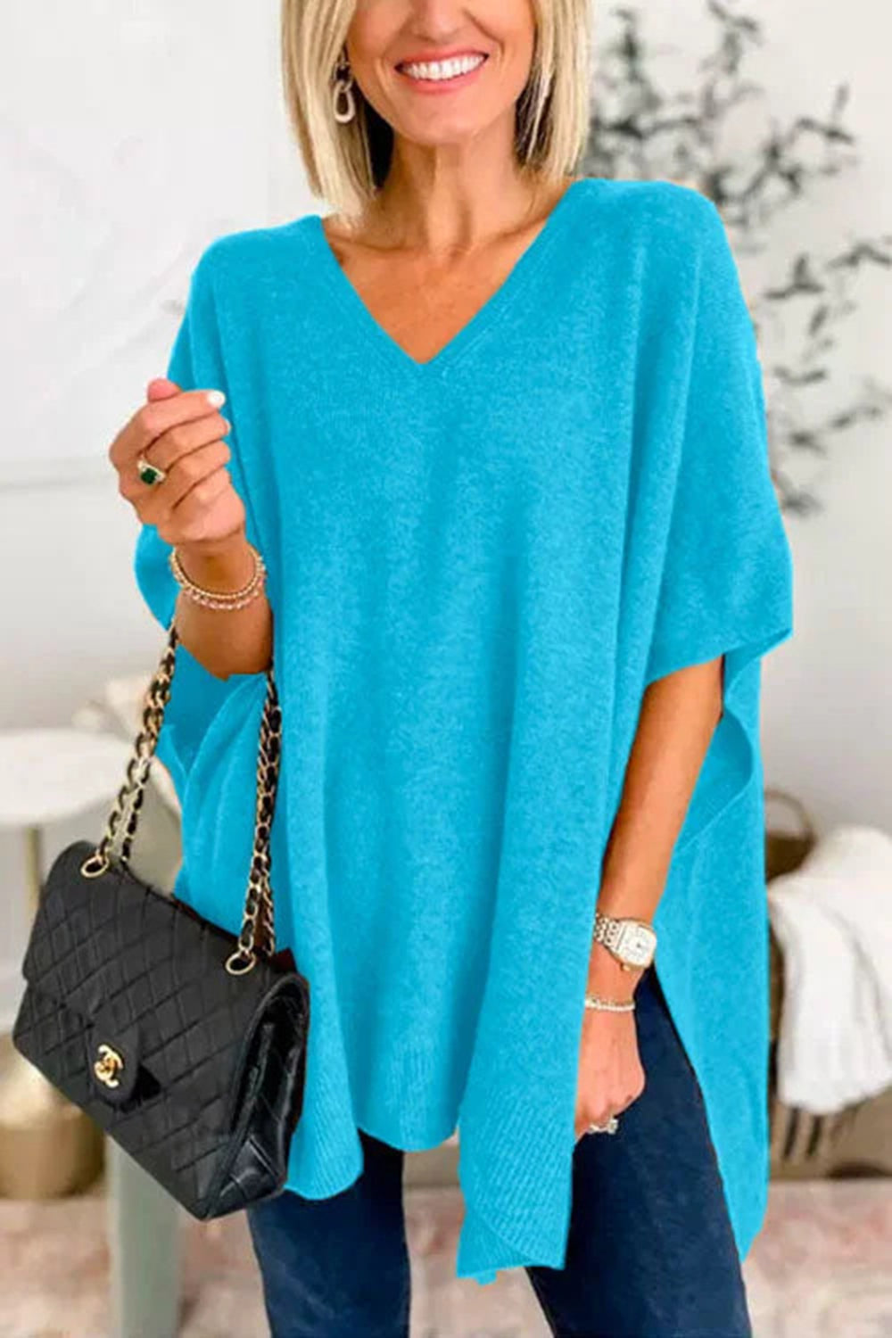 Erika | Slit knit top with V-neck and half sleeves