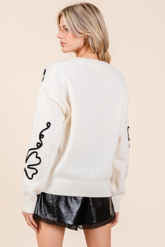 Adriana | Knitted sweater with floral embroidery