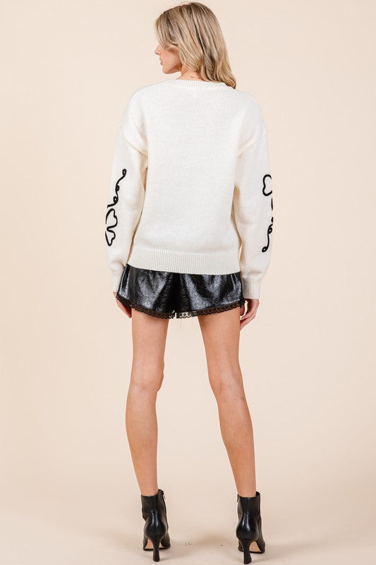 Cecilia | Plus knitted sweater with floral embroidery
