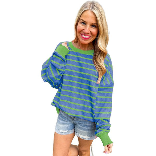 Selma | Orange striped loose sweater with a crew neck and shoulders