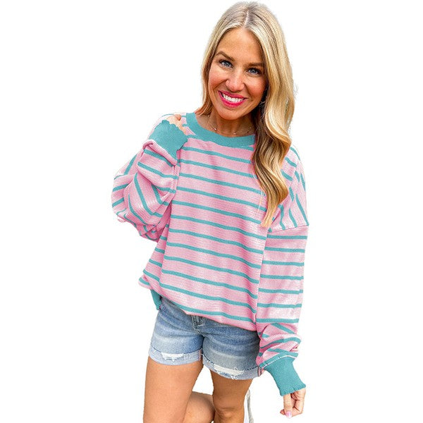 Selma | Orange striped loose sweater with a crew neck and shoulders