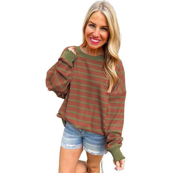 Selma | Orange striped loose sweater with a crew neck and shoulders