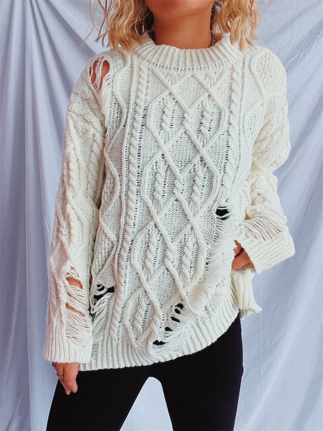 Clara | Long-sleeved, crew-neck, distressed cable-knit sweater