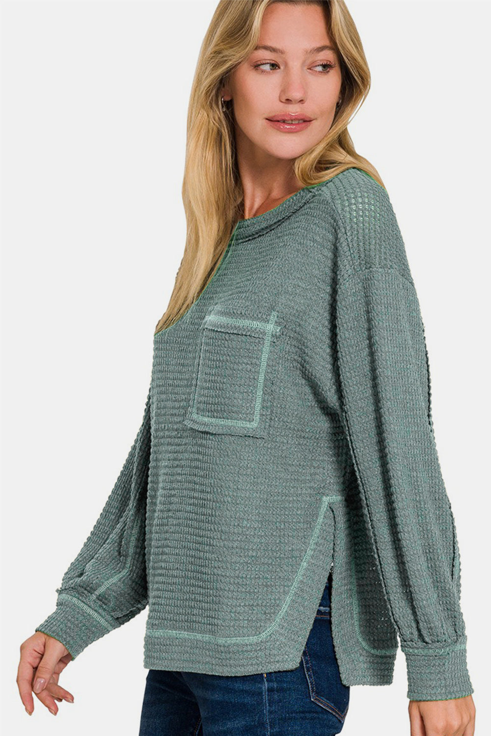 Daria | Long sleeve top with exposed seam and side slit