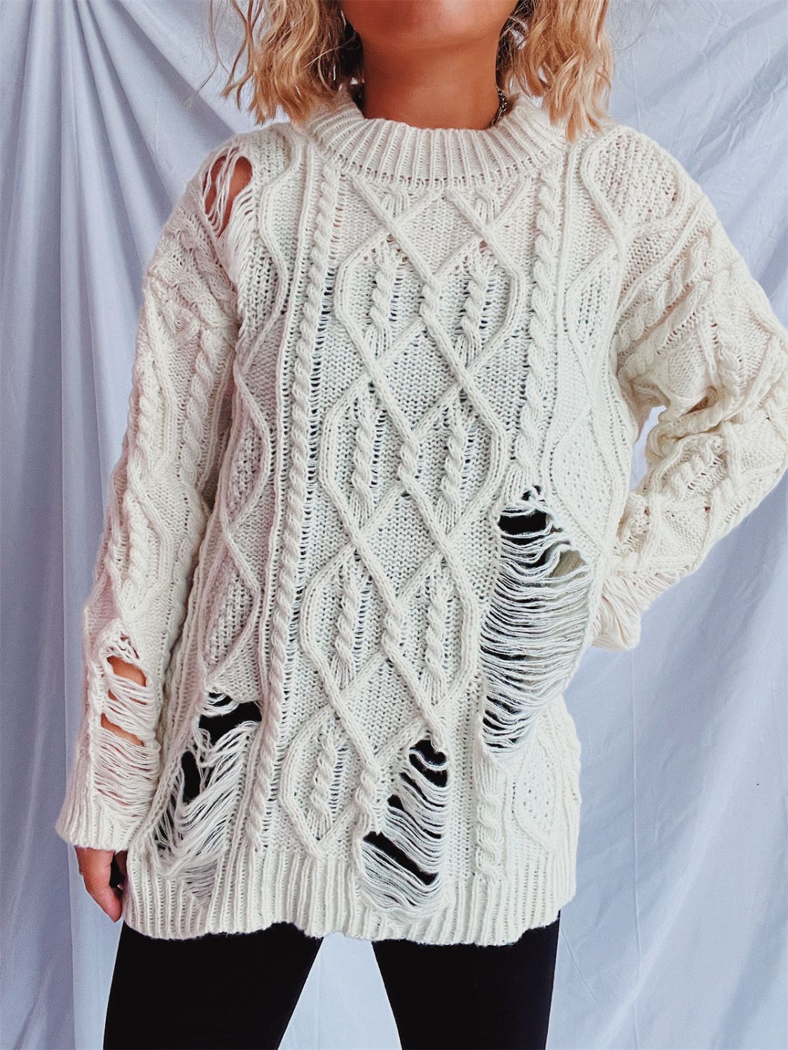 Clara | Long-sleeved, crew-neck, distressed cable-knit sweater
