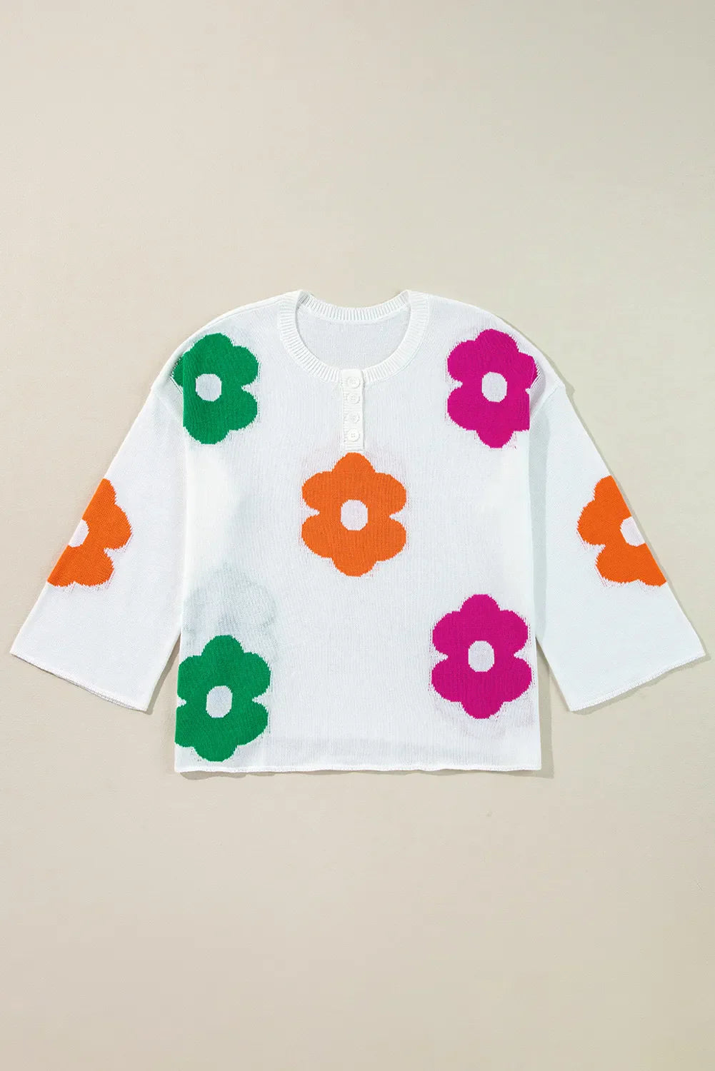 Delia | Floral knit top with a crew neck and quarter buttons