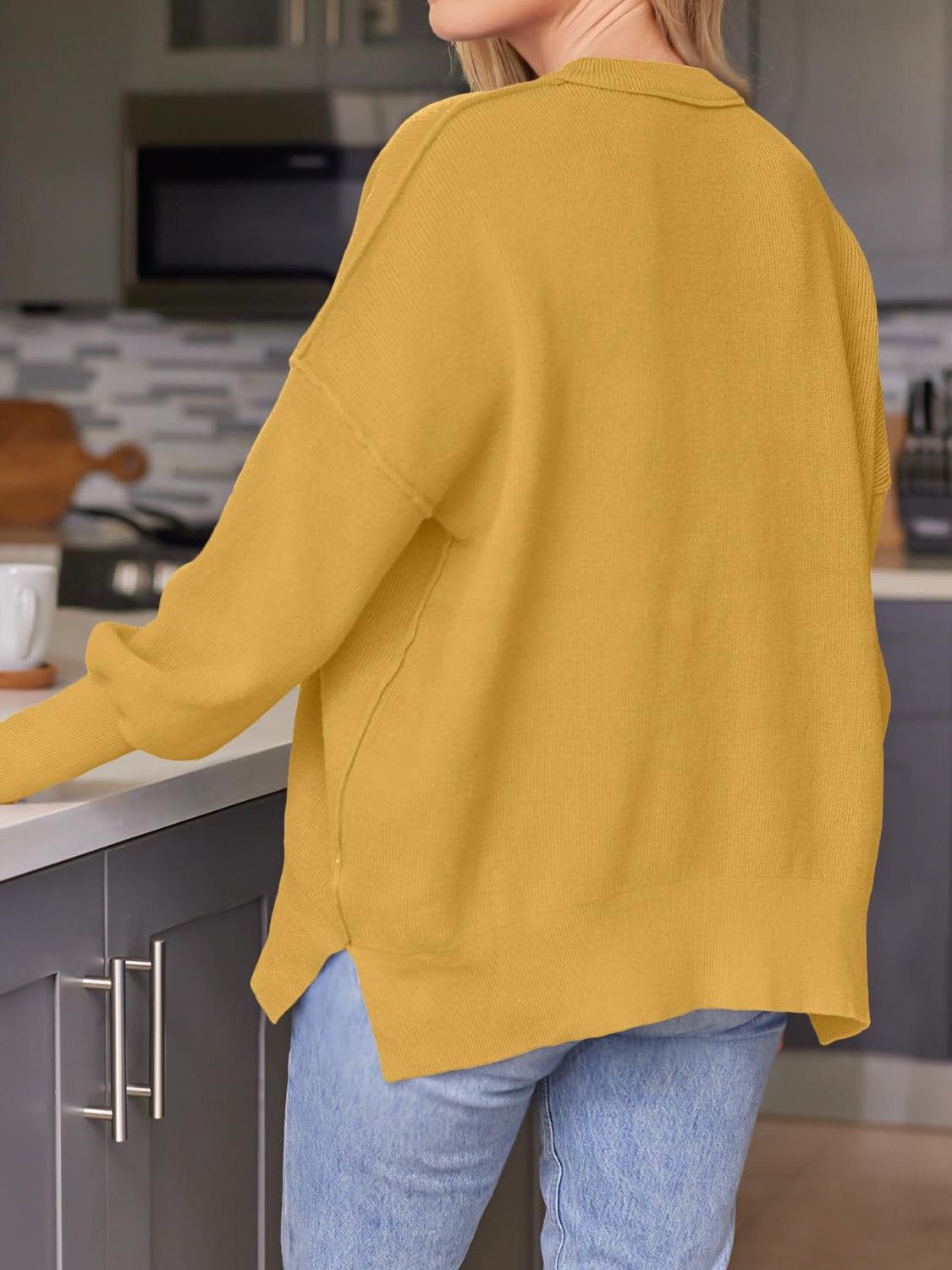Evelyn | Slit sweater with a crew neck and dropped shoulders