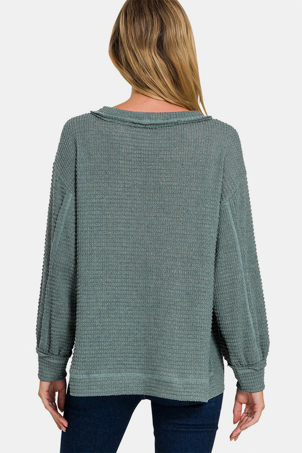 Daria | Long sleeve top with exposed seam and side slit