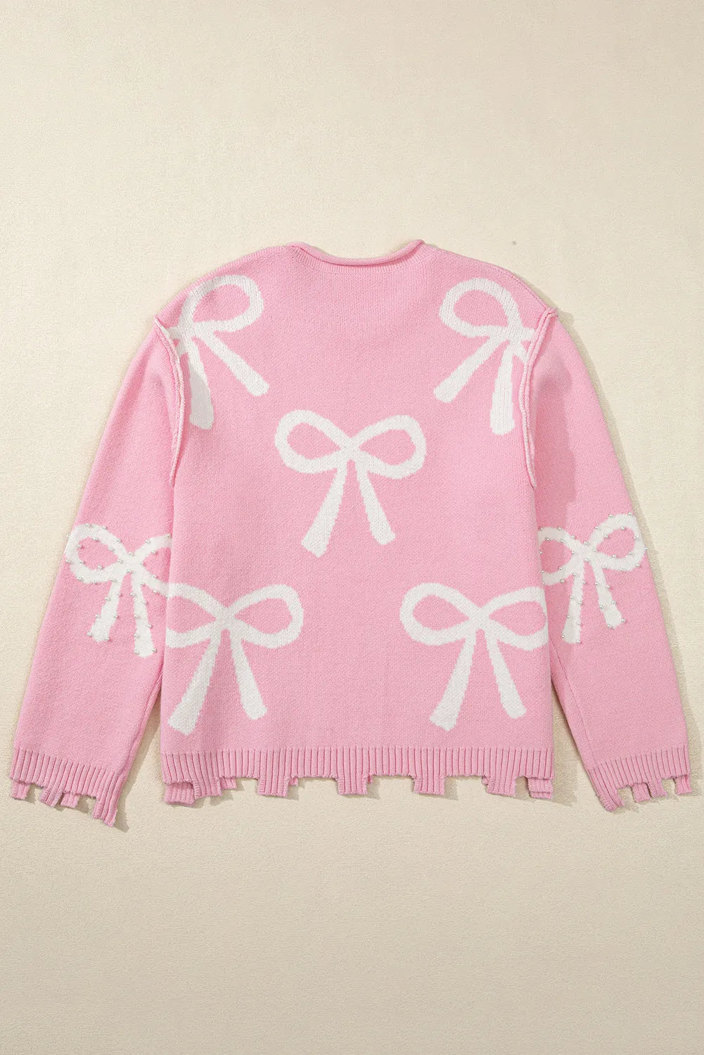 Yessica | Long-sleeved crew neck sweater with pearl detail and bow