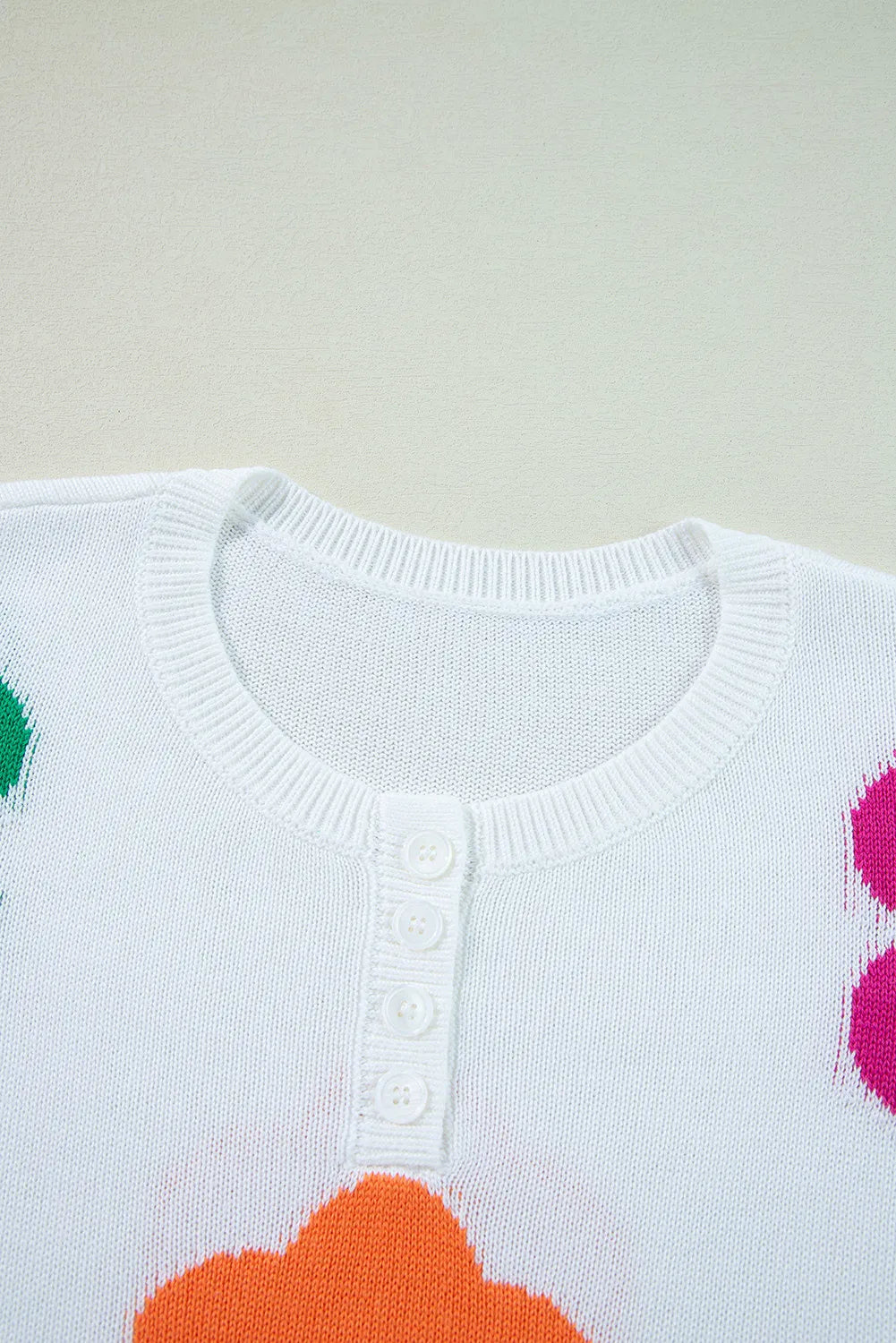 Delia | Floral knit top with a crew neck and quarter buttons
