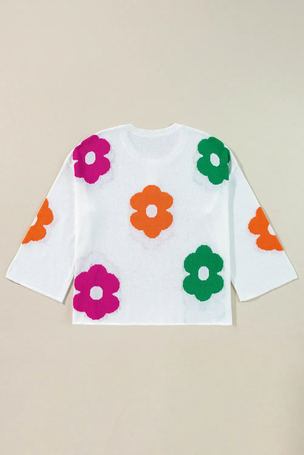 Delia | Floral knit top with a crew neck and quarter buttons