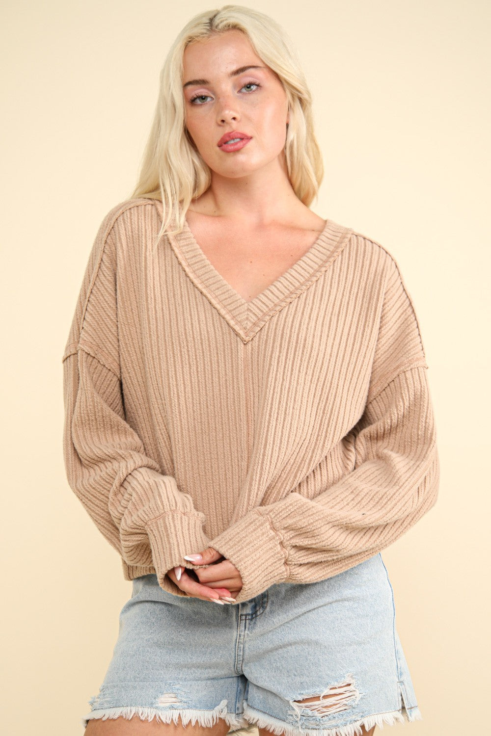 Hilda | Ribbed knit top with exposed seam and V-neck