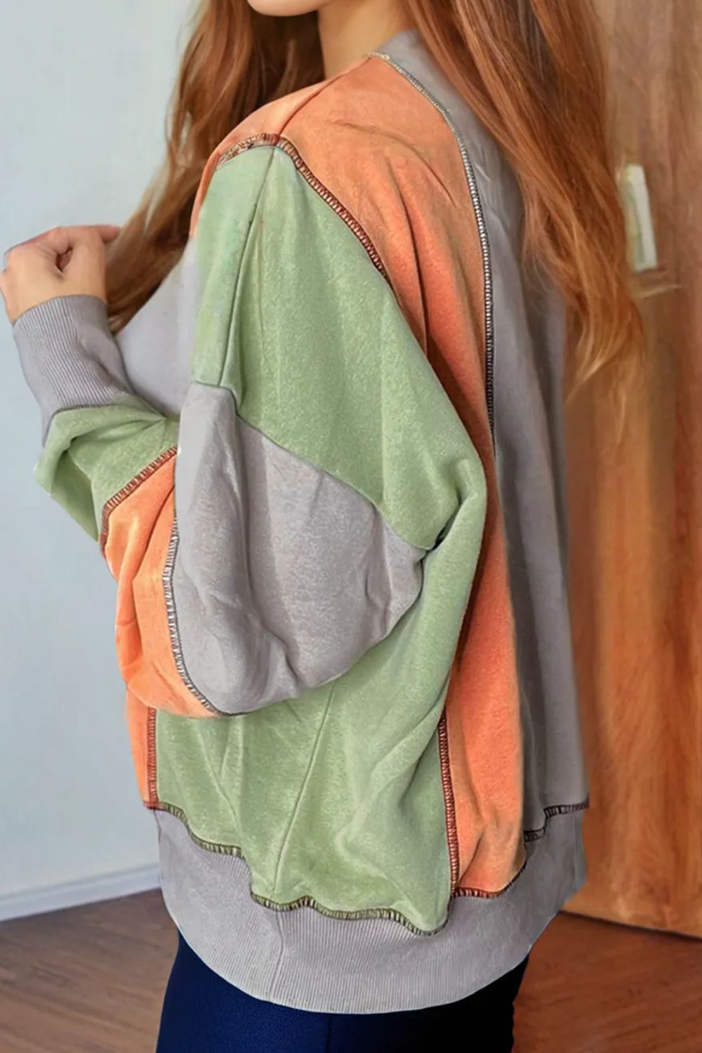 Andrea | Full size long sleeve sweatshirt with exposed seams and color block pattern