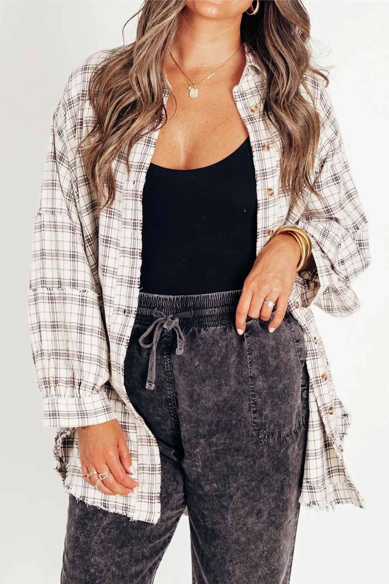 Vanja | Checked blouse with button placket, fringes and slit hem