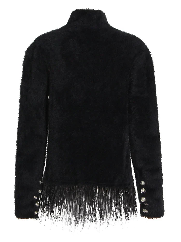 Natividad | Patchwork blazer with feather accessories