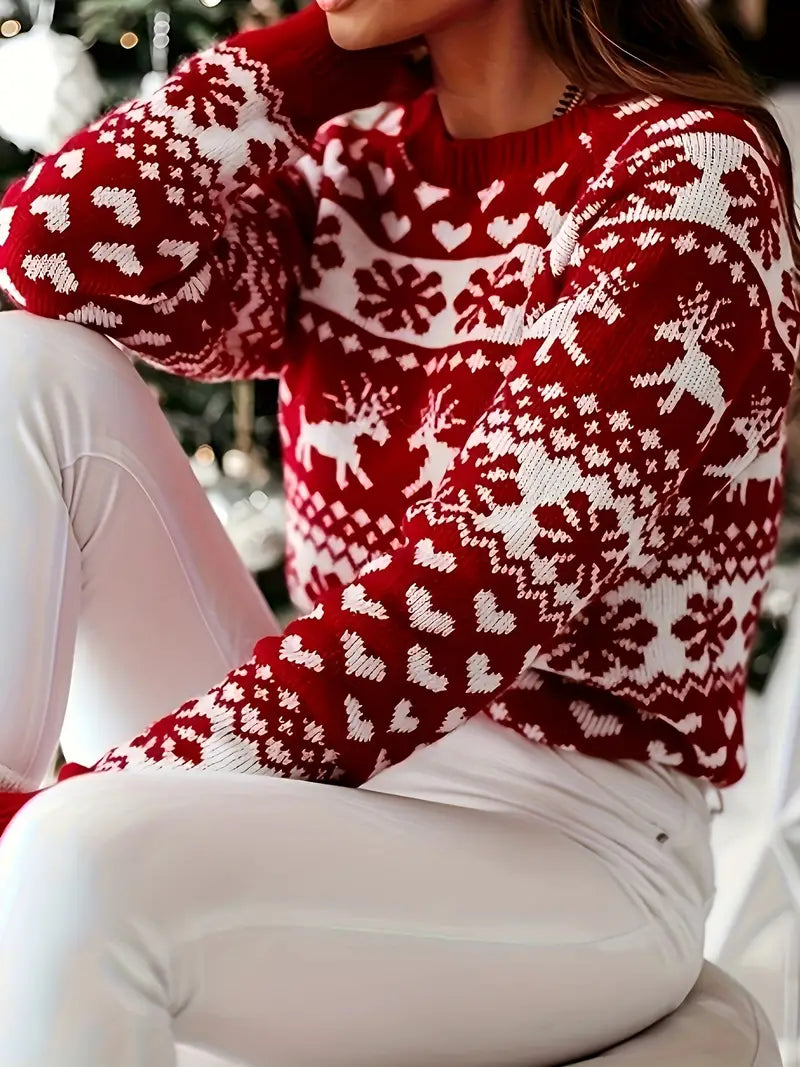 Yara | Festive sweater with a reindeer and snowflake design.