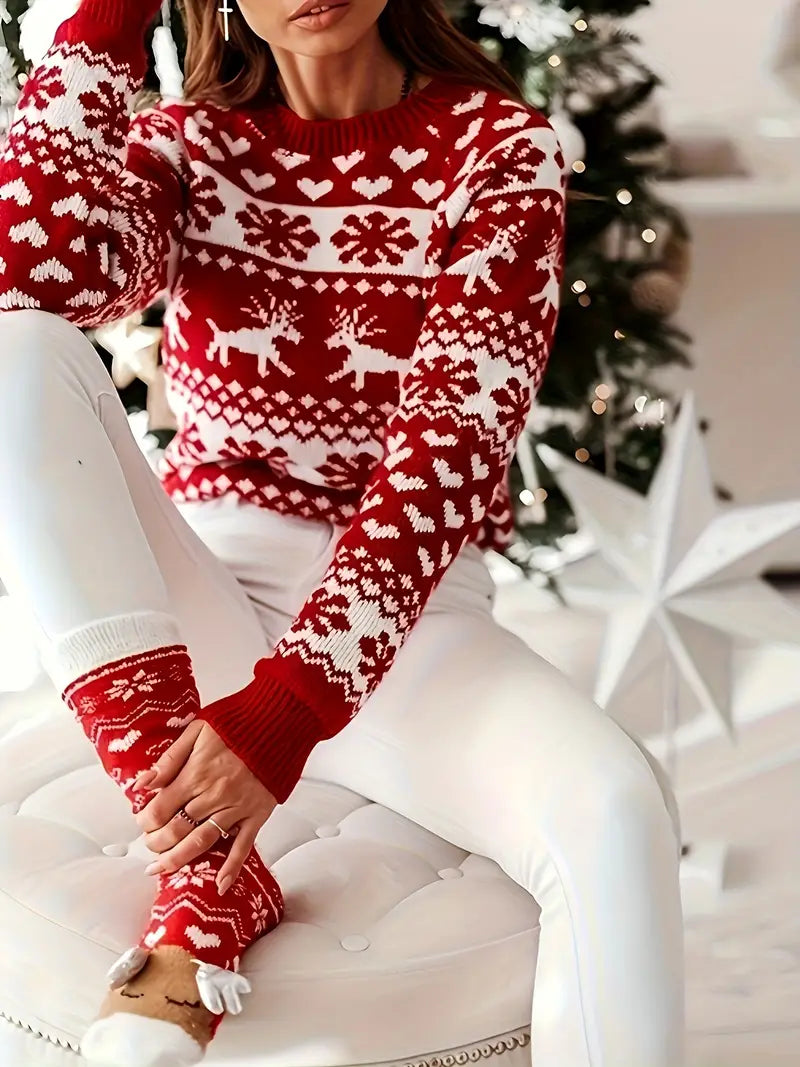 Yara | Festive sweater with a reindeer and snowflake design.