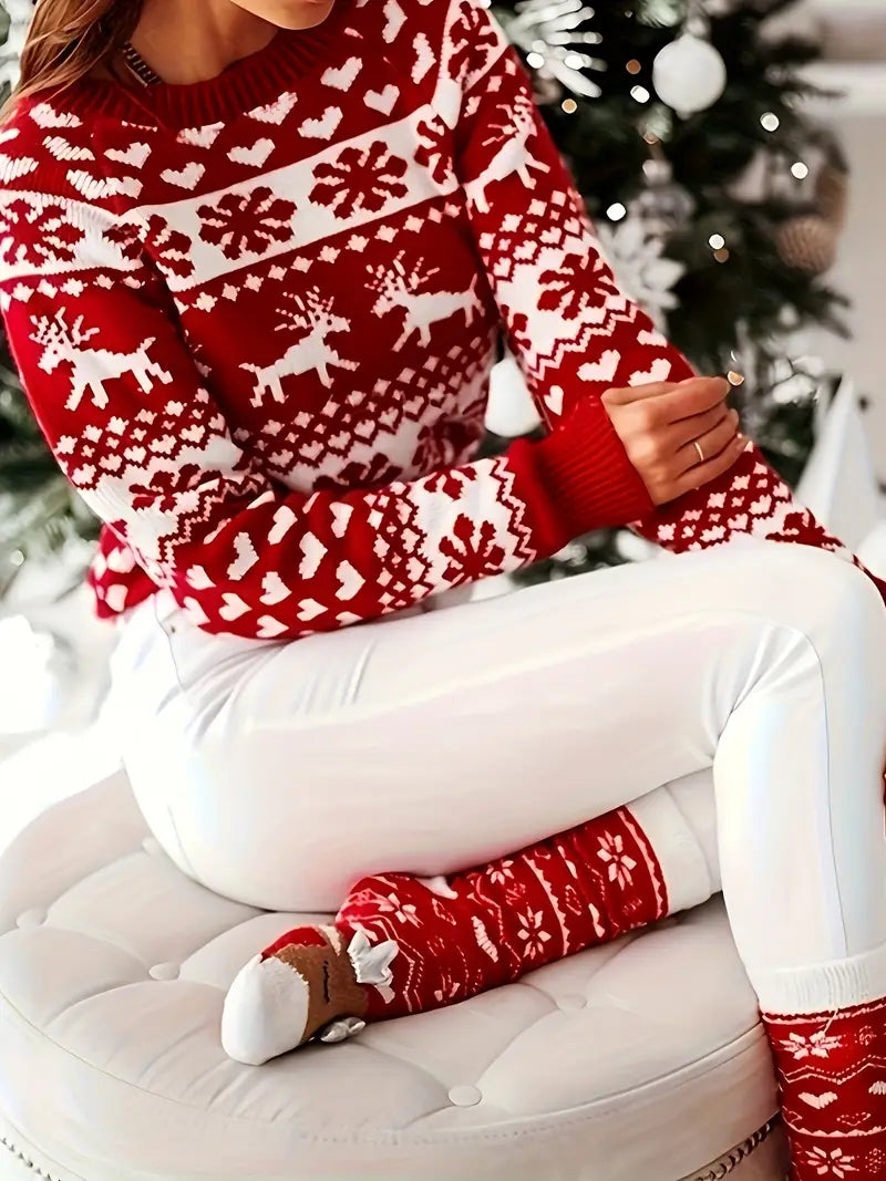 Yara | Festive sweater with a reindeer and snowflake design.