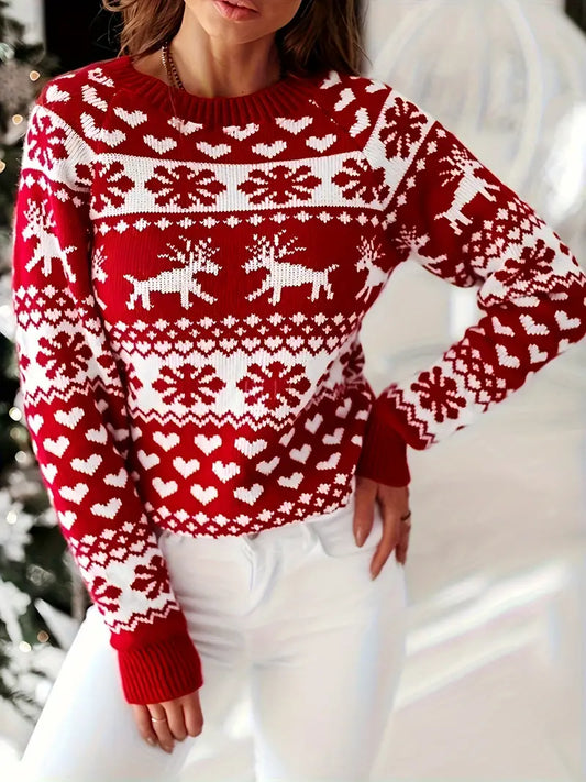 Yara | Festive sweater with a reindeer and snowflake design.