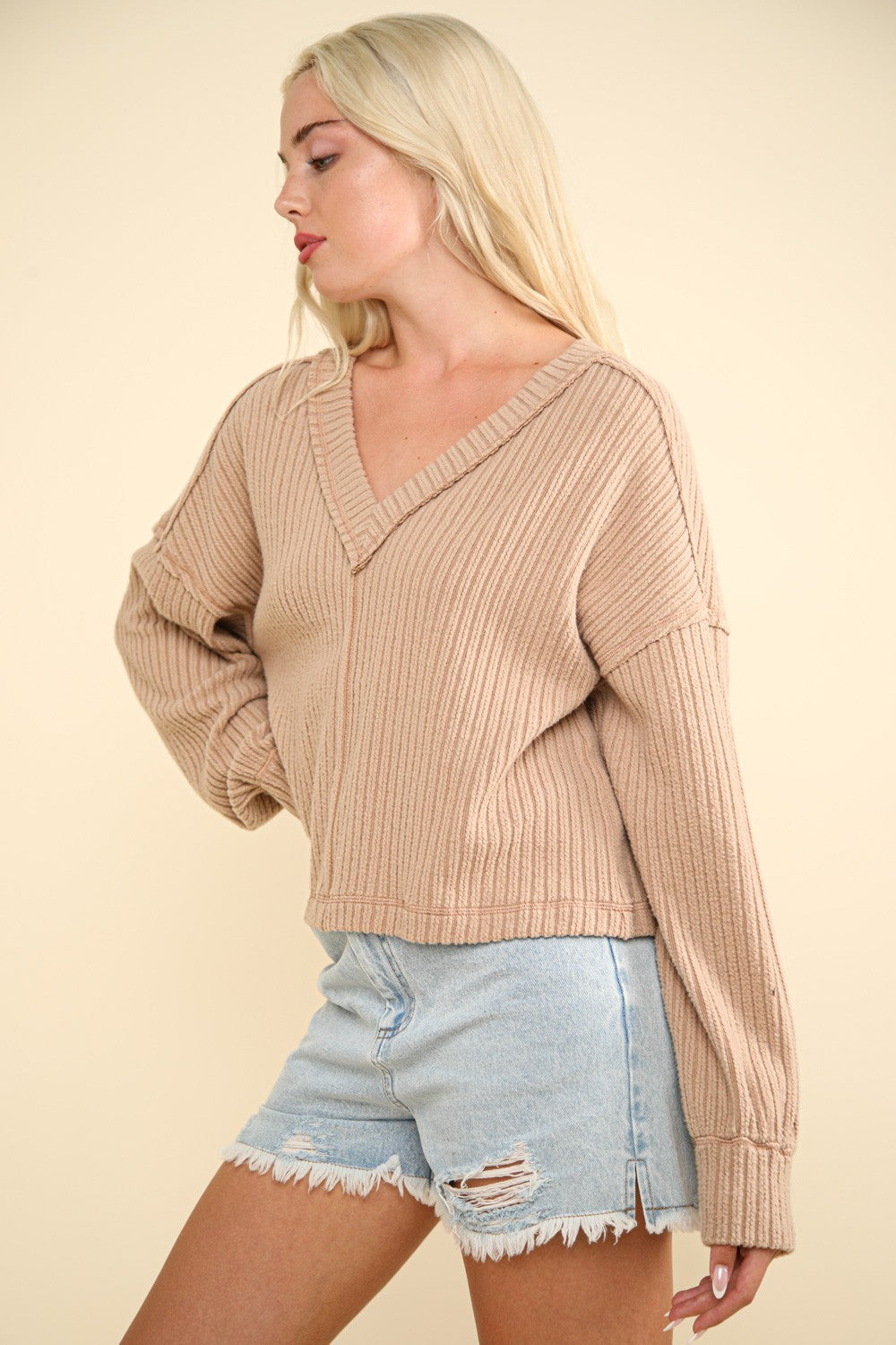 Hilda | Ribbed knit top with exposed seam and V-neck