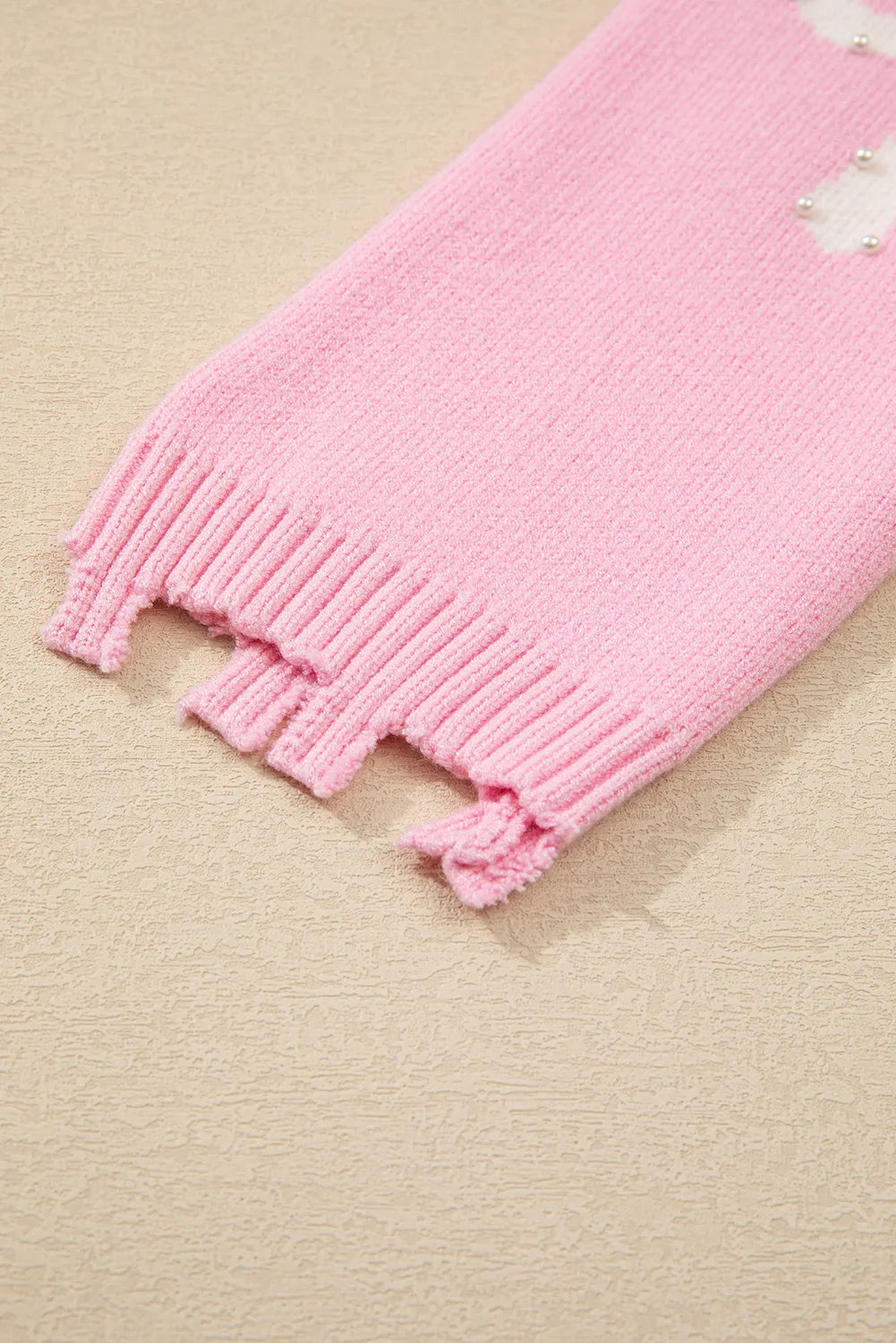 Yessica | Long-sleeved crew neck sweater with pearl detail and bow