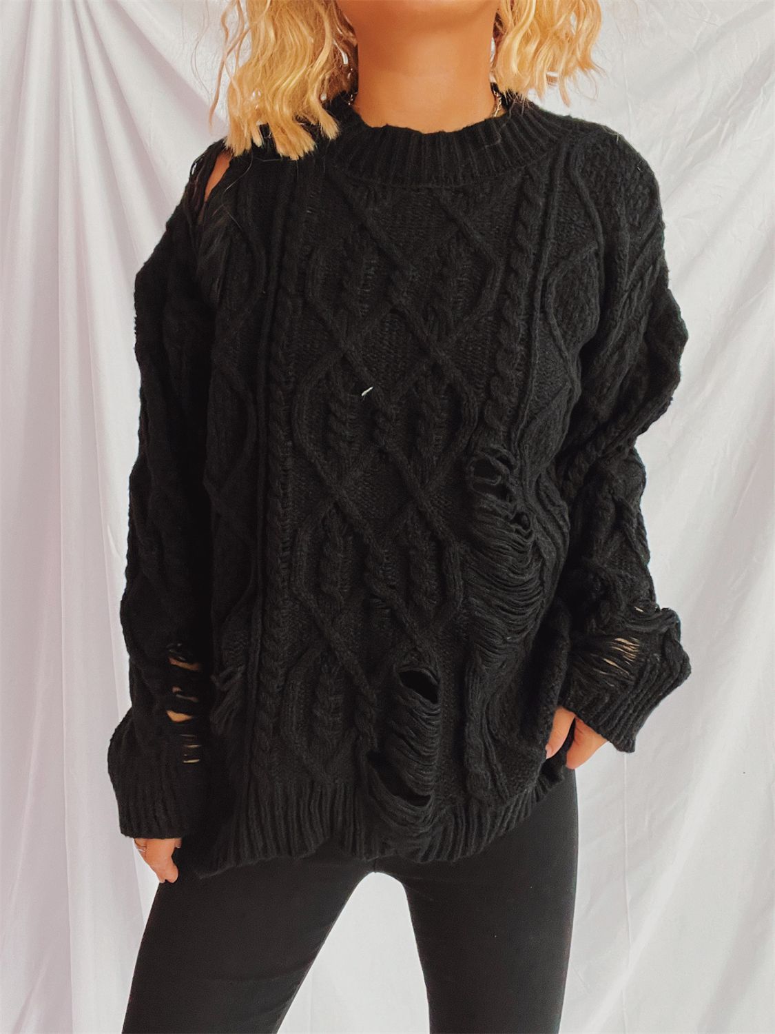 Clara | Long-sleeved, crew-neck, distressed cable-knit sweater