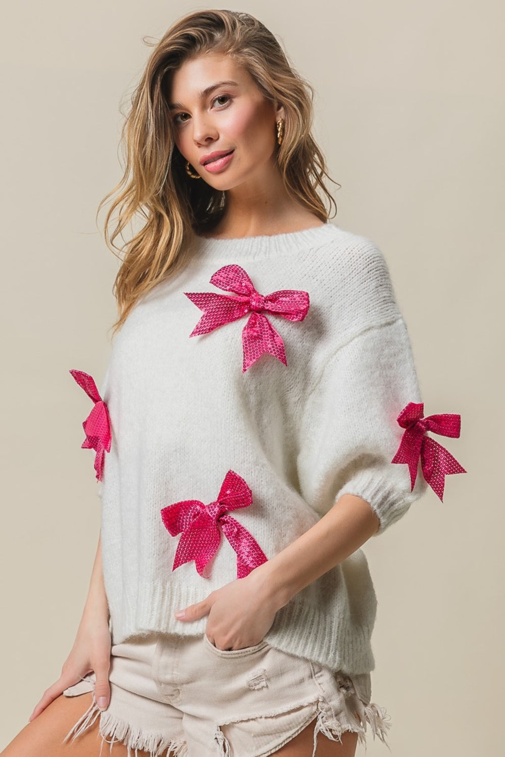 Victoria | Jumper with sequin bow and puff sleeves