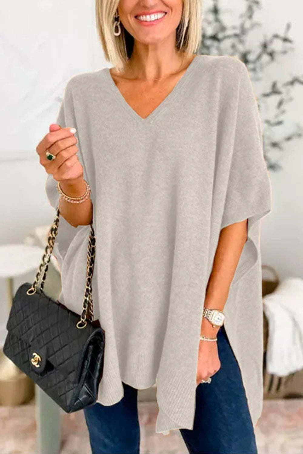 Erika | Slit knit top with V-neck and half sleeves