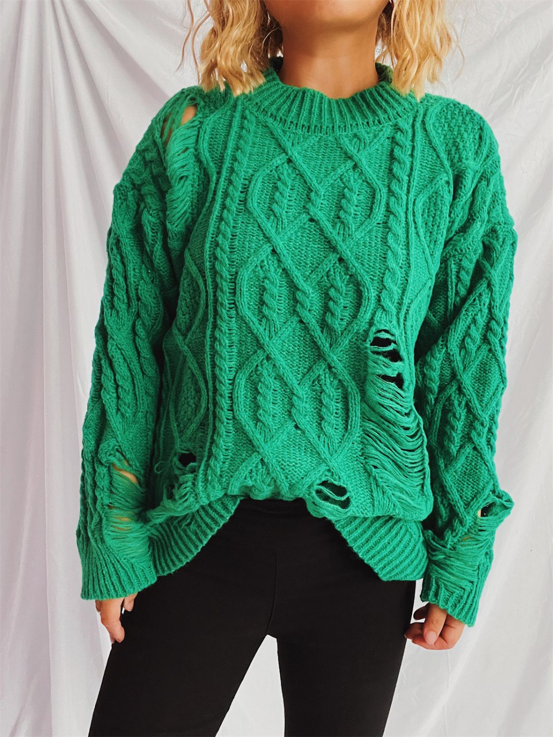 Clara | Long-sleeved, crew-neck, distressed cable-knit sweater