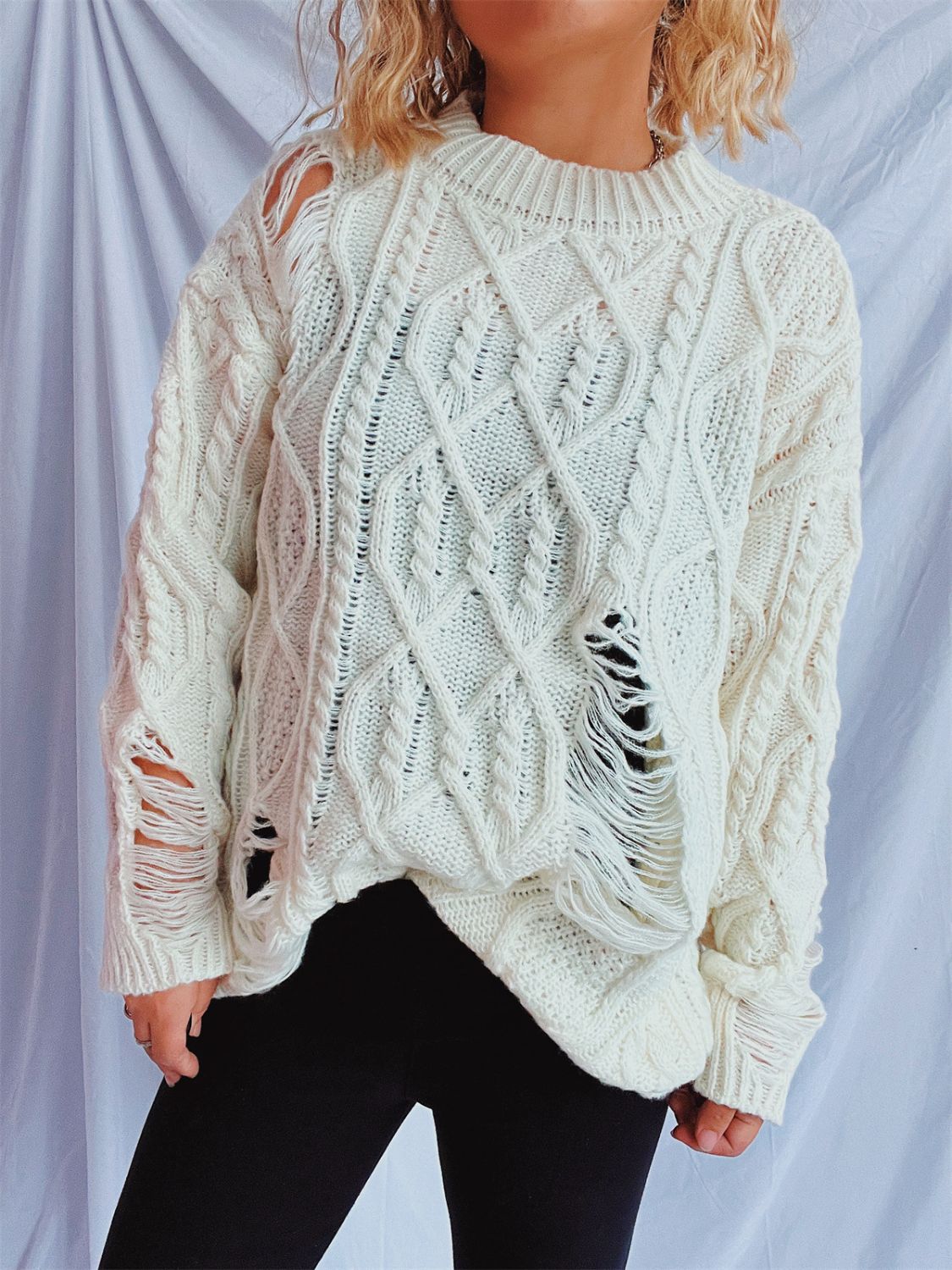 Clara | Long-sleeved, crew-neck, distressed cable-knit sweater