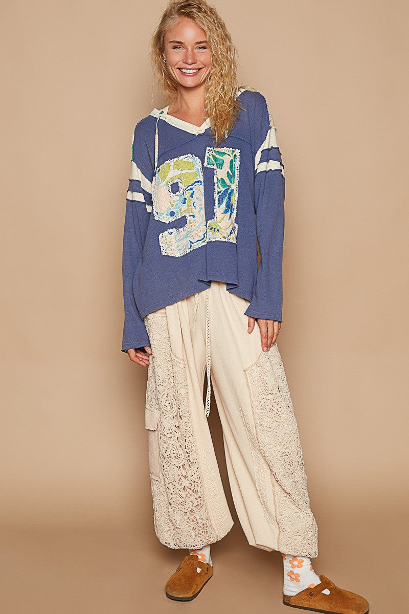Rebeca | POL hooded top with exposed seam and number patch and V-neck