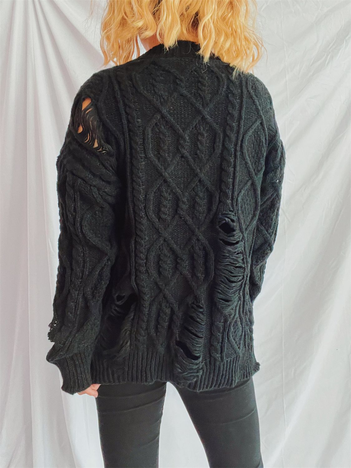 Clara | Long-sleeved, crew-neck, distressed cable-knit sweater