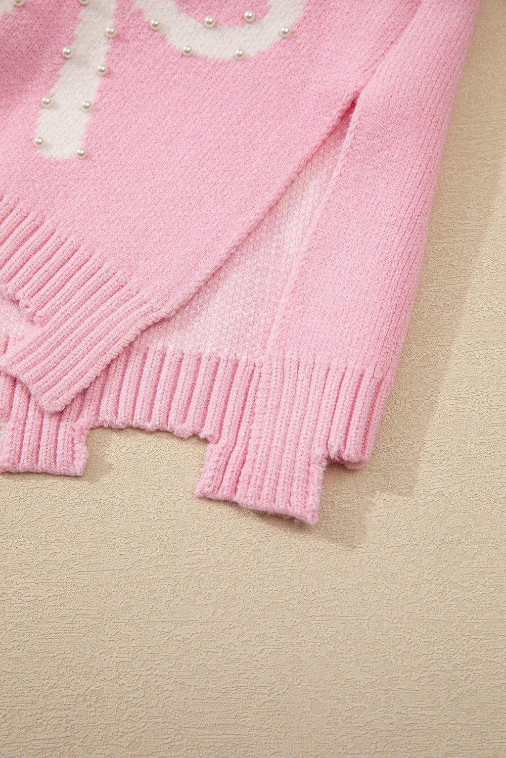 Yessica | Long-sleeved crew neck sweater with pearl detail and bow