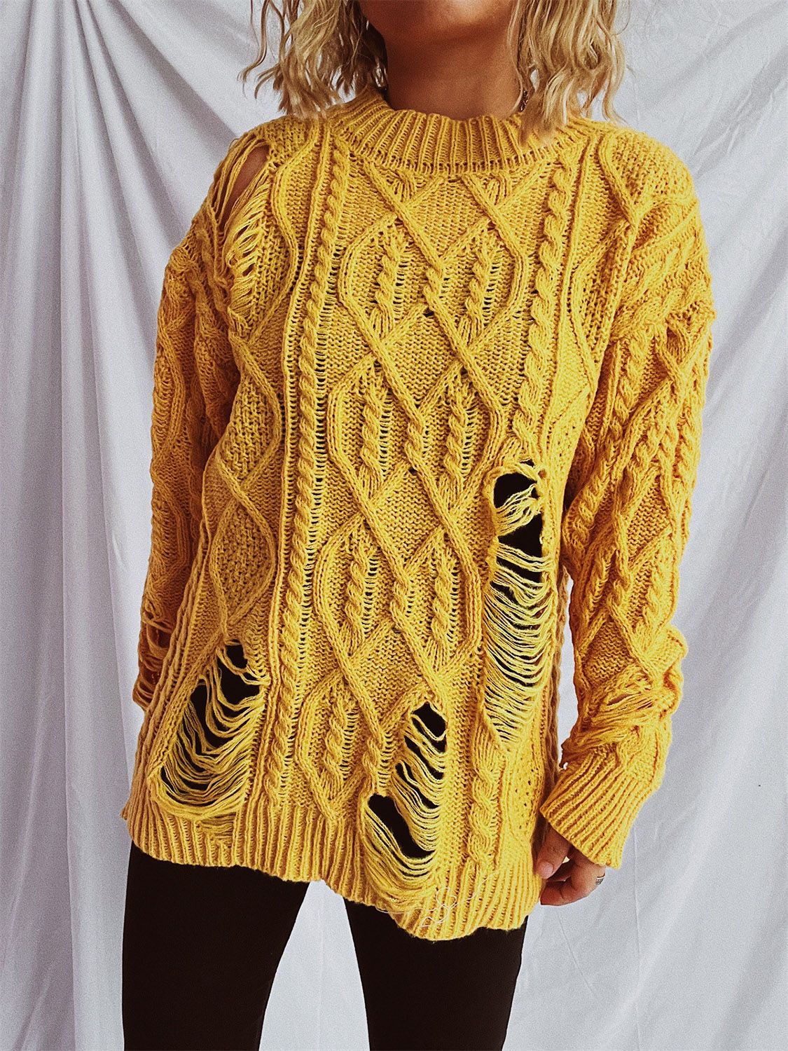 Clara | Long-sleeved, crew-neck, distressed cable-knit sweater